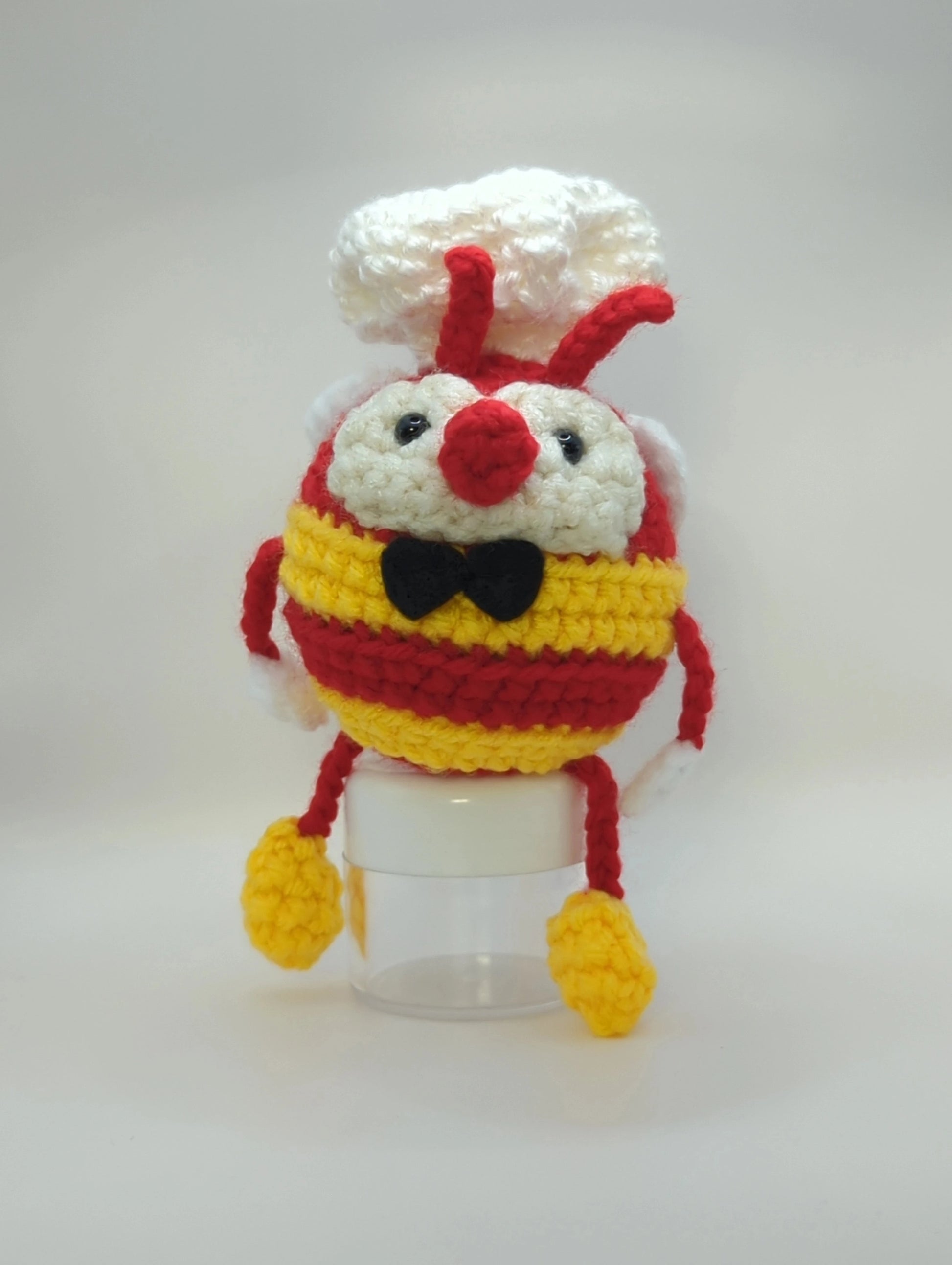 Crocheted soft toy of a bumble bee dressed like the mascot of popular Filipino food chain, Jollibee