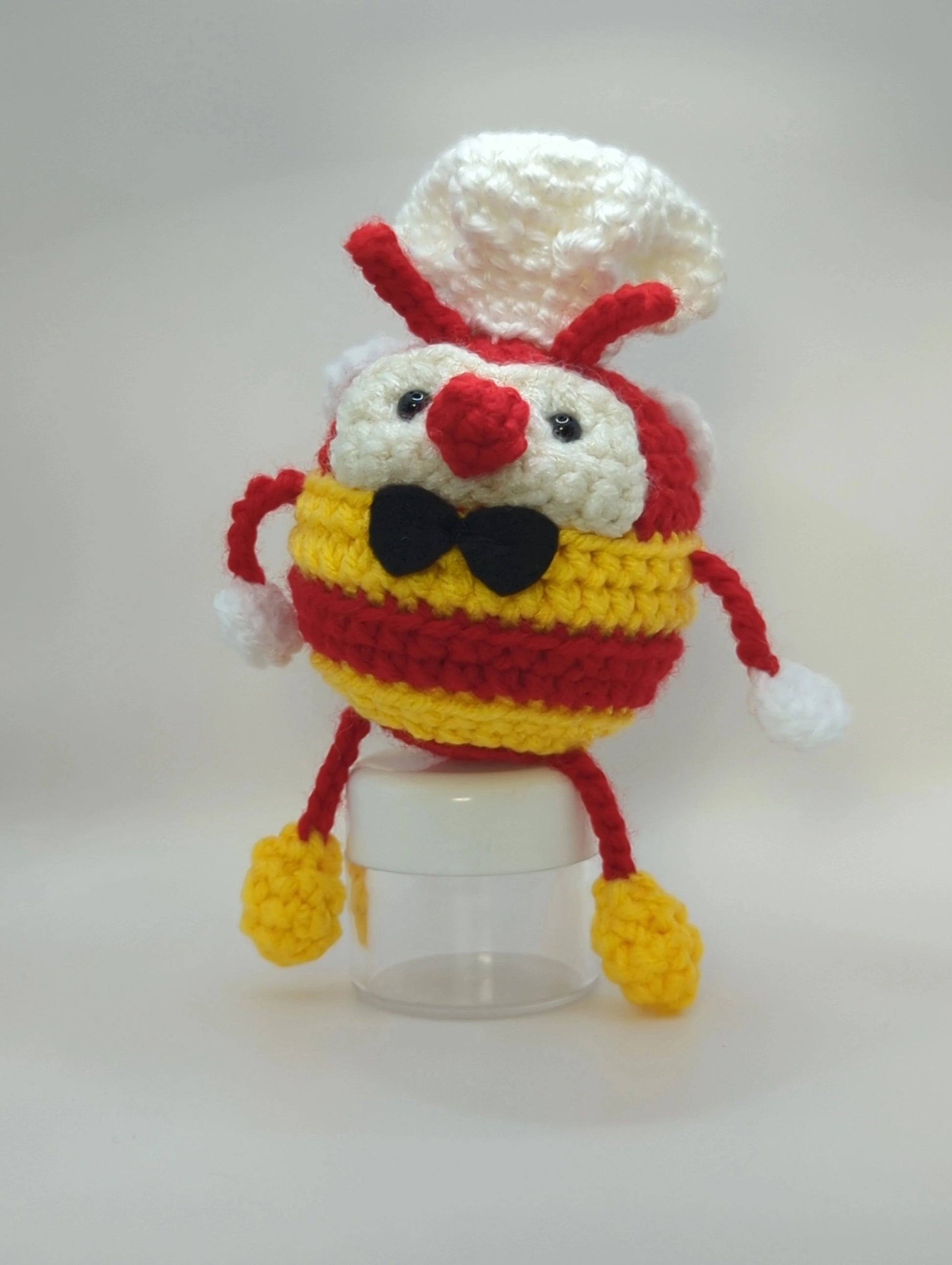 Crocheted soft toy of a bumble bee dressed like the mascot of popular Filipino food chain, Jollibee